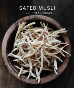 Dried Safed Musli roots in a wooden bowl from Riddhi Healthcare, offering safed musli benefits